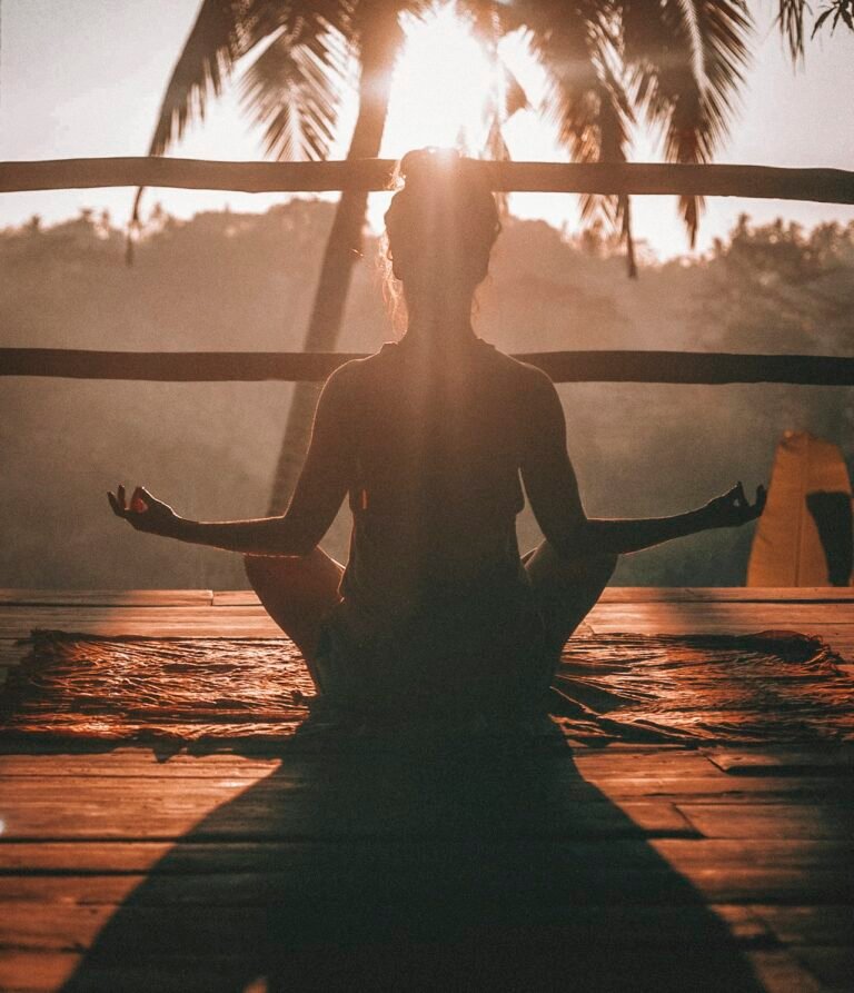 A calm figure practicing mindful breathing on a sunlit wooden floor, evoking stress recovery and a return to baseline